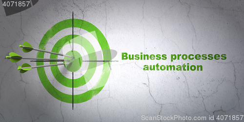 Image of Business concept: target and Business Processes Automation on wall background