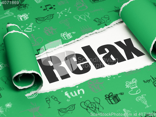 Image of Holiday concept: black text Relax under the piece of  torn paper