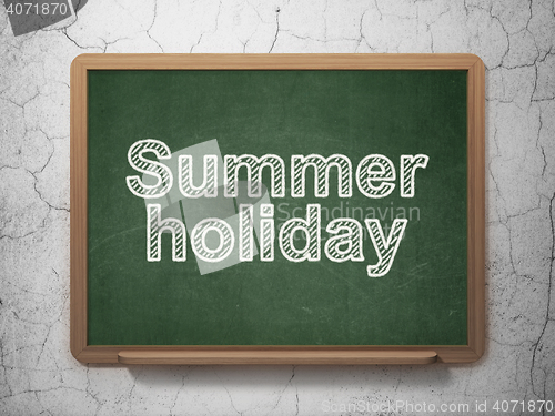 Image of Vacation concept: Summer Holiday on chalkboard background