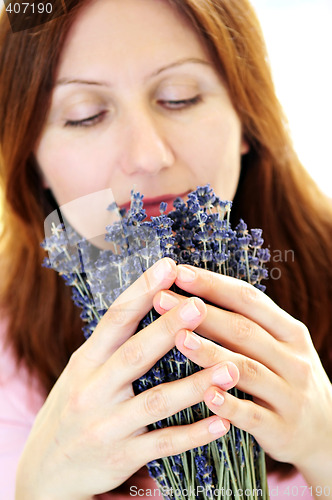 Image of Woman smelling lavender