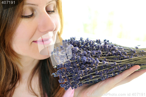 Image of Woman smelling lavender