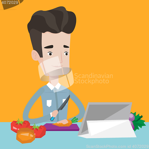 Image of Man cooking healthy vegetable salad.