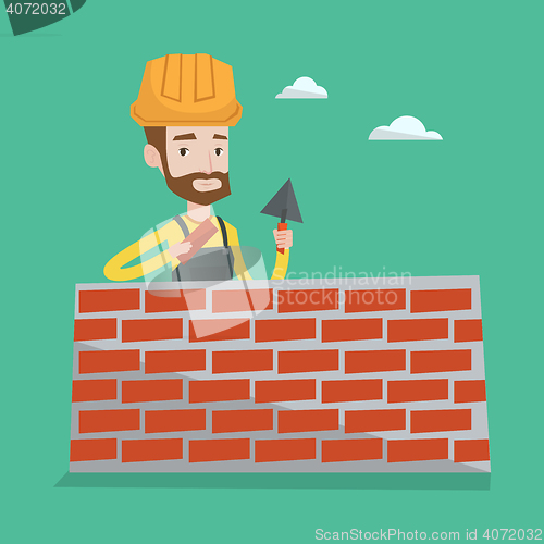 Image of Bricklayer working with spatula and brick.