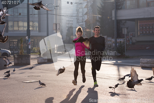 Image of young  couple jogging