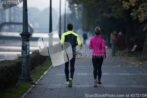 Image of young  couple jogging