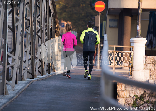 Image of young  couple jogging