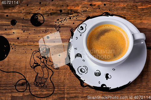 Image of Coffee cup on a wooden table.