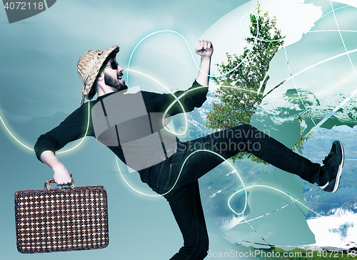 Image of man wtih suitcase ready to travel as tourist on gray background