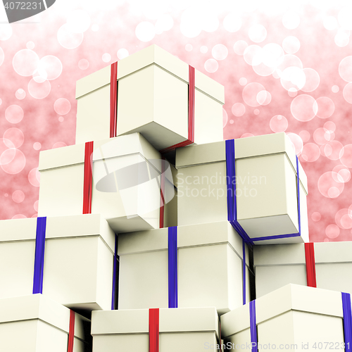 Image of Stack Of Giftboxes With Bokeh Background As Presents For The Fam