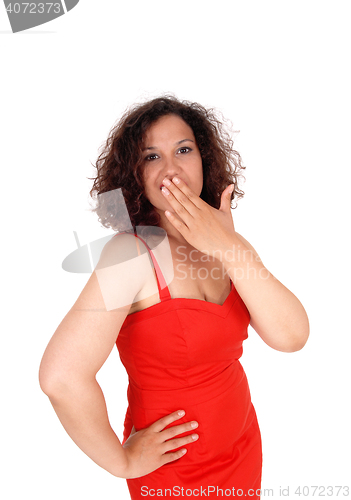 Image of Shocked woman with hand over mouth.