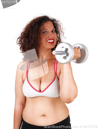 Image of Busty woman with dumbbells.