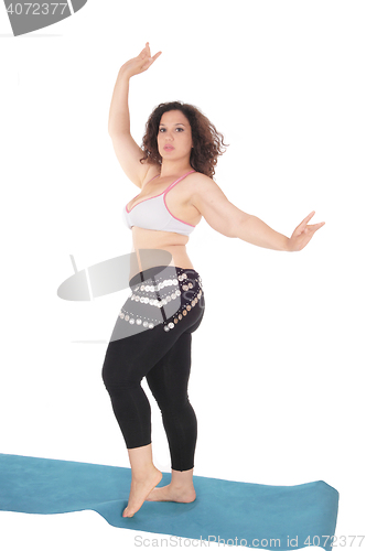 Image of Belly dancing young woman.