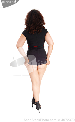 Image of Woman showing her buttock.