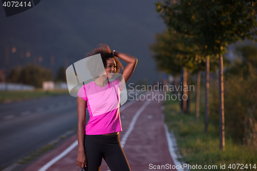 Image of Portrait of a young african american woman running outdoors