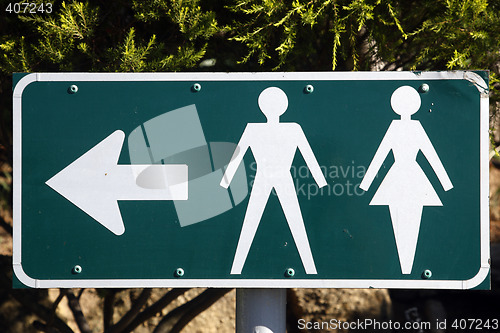 Image of male and female toilet directions sign