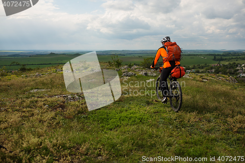 Image of Young man is riding bicycle outside. Healthy Lifestyle.