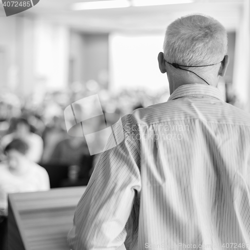 Image of Speaker at Business Conference and Presentation.