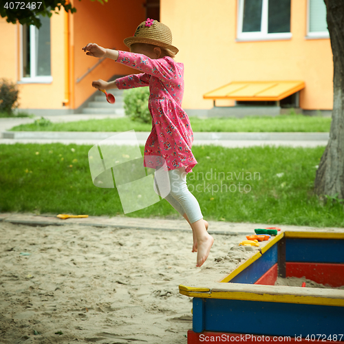 Image of Child on playground in summer park