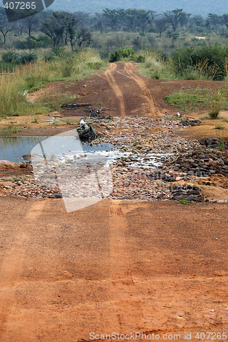 Image of dirt track crossing a stream