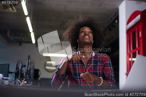 Image of portrait of a young successful African-American woman in modern 