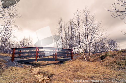 Image of Bridge over an empty river stream