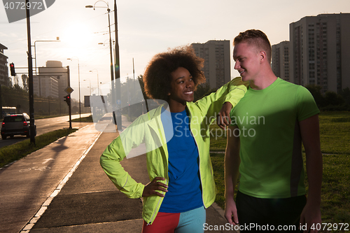 Image of Portrait of romantic pretty couple on fitness session, outside t