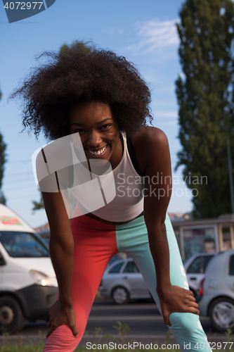 Image of Portrait of sporty young african american woman running outdoors