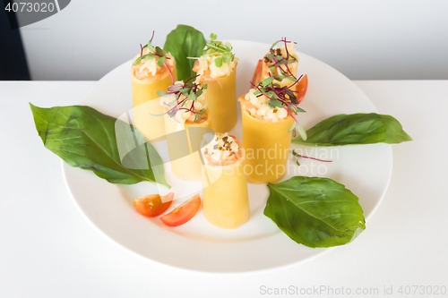Image of appetizer - cheese rolls with meat and vegetables