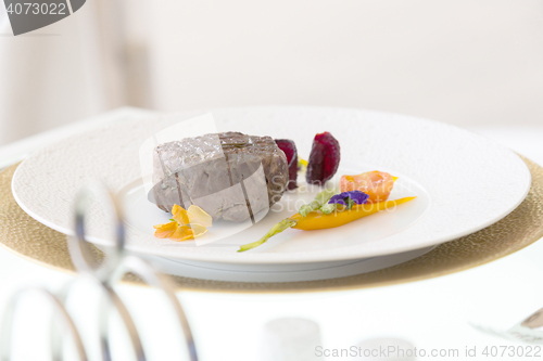 Image of minimalistic dish steak with vegetables