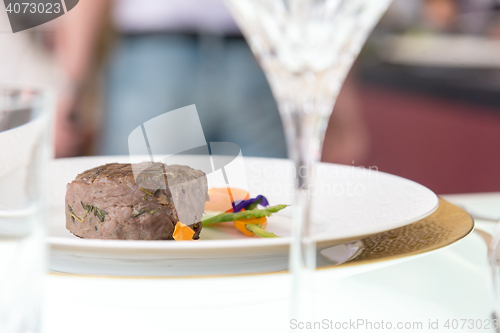 Image of minimalistic dish steak with vegetables