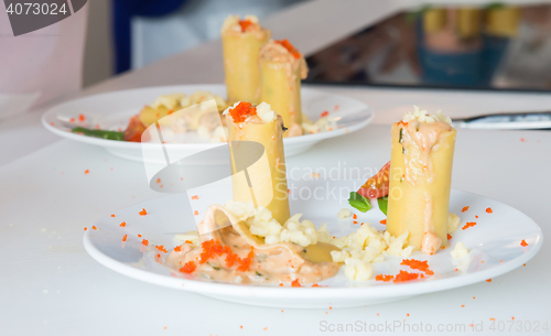 Image of appetizer - cheese rolls with meat and vegetables