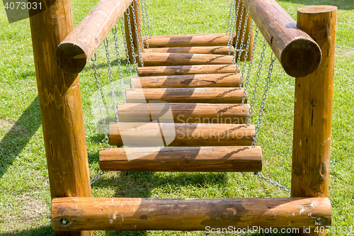 Image of childrens bridge made of logs and chains