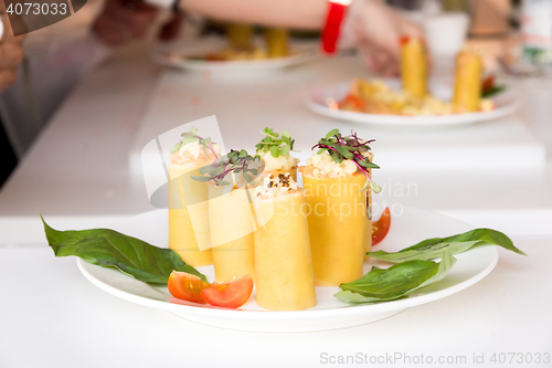 Image of appetizer - cheese rolls with meat and vegetables