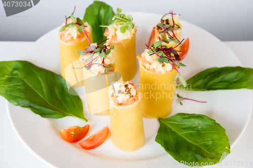 Image of appetizer - cheese rolls with meat and vegetables