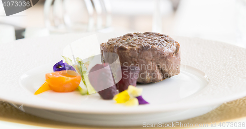 Image of minimalistic dish steak with vegetables