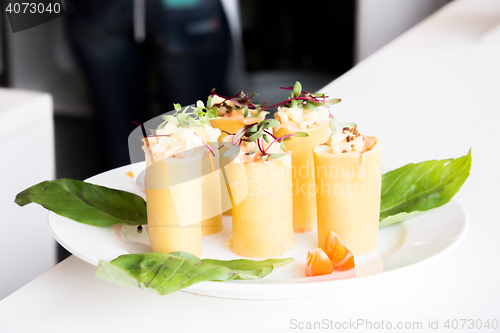 Image of appetizer - cheese rolls with meat and vegetables