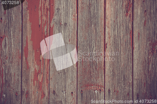 Image of Wooden planks background with red paint