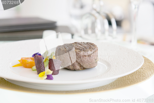 Image of minimalistic dish steak with vegetables