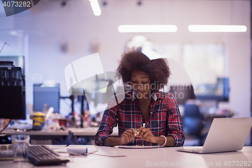 Image of portrait of a young successful African-American woman in modern 