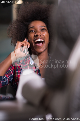 Image of portrait of a young successful African-American woman in modern 