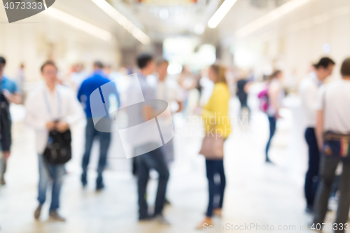 Image of Abstract blurred people socializing during coffee break at business conference.