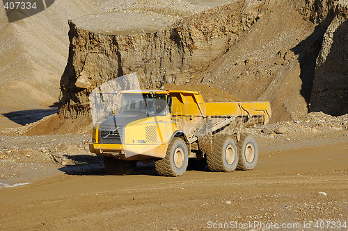 Image of Yellow dump truck in mine