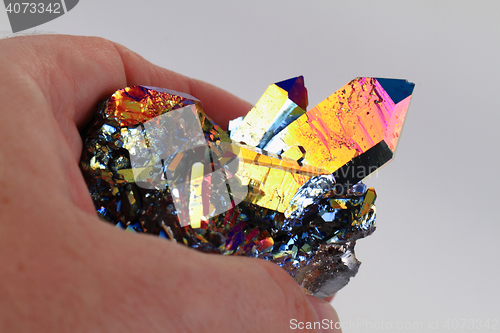 Image of crystal with metal rainbow surface