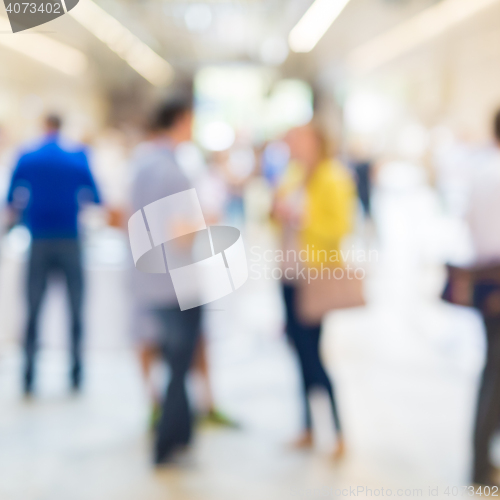 Image of Abstract blurred people socializing during coffee break at business conference.