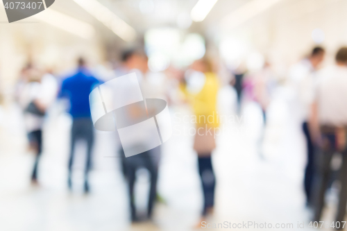 Image of Abstract blurred people socializing during coffee break at business conference.