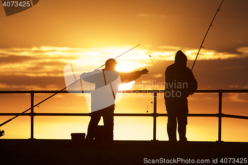 Image of Fishing men at the beach