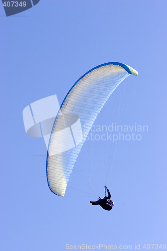 Image of Paraglider in blue sky