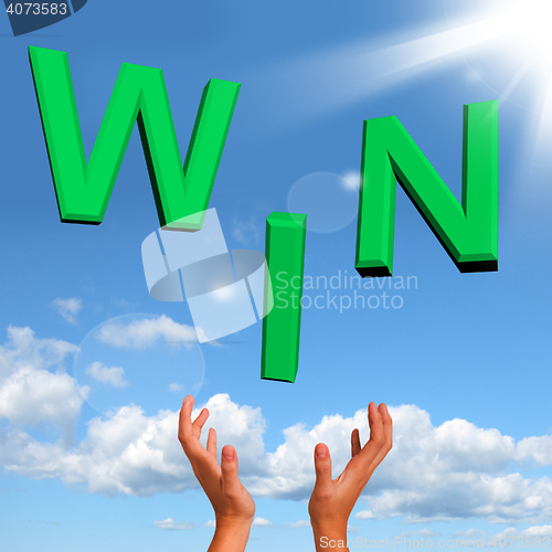 Image of Catching Win Word On Table Representing Success And Victory