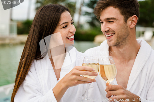 Image of Young couple tasting wine