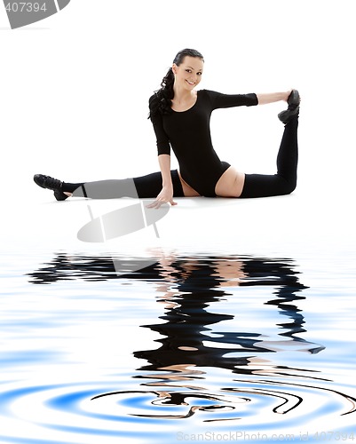 Image of fitness instructor in black leotard on white sand #2